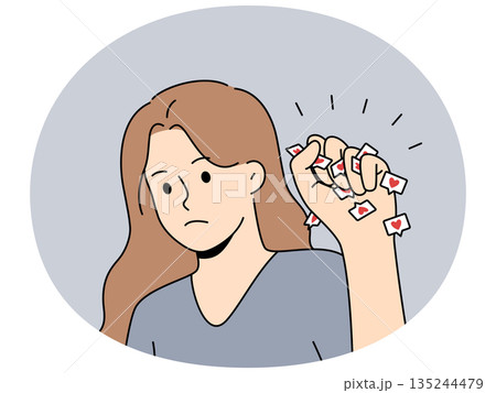 Woman struggles with social media addiction and clenches heart icons in fist to protest Woman struggles with social media addiction and clenches heart icons in fist to protest 135244479