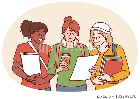 Multiethnic college girls holding books and papers agreeing to study together for exams 135245170