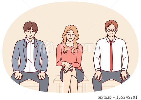 Business people sit on chairs in line for interview for manager position in corporation 135245201