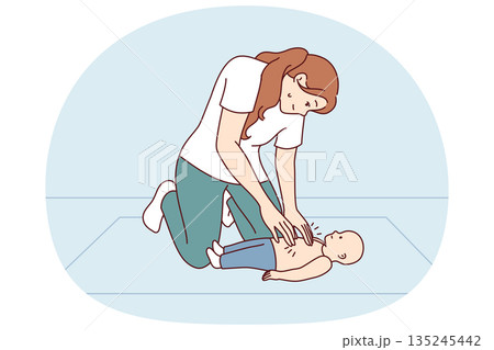 Woman doing CPR massage to infant providing first aid for heart attack or insult. 135245442