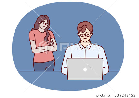 Frustrated woman near husband using laptop and suffering from internet addiction 135245455