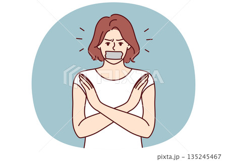 Woman with tape on mouth crosses arms calling for end to discrimination or violation female rights Woman with tape on mouth crosses arms calling for end to discrimination or violation female rights 135245467