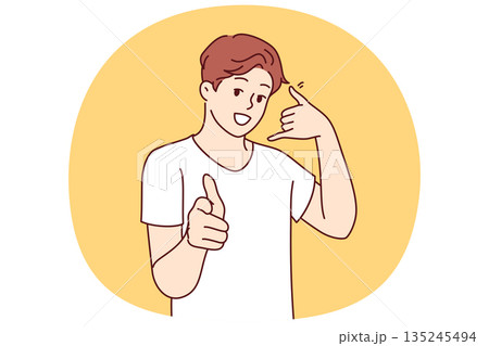 Man makes call me gesture and points finger at screen inviting you to dial support or sales agent Man makes call me gesture and points finger at screen inviting you to dial support or sales agent 135245494