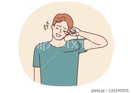 Laughing man takes off glasses wiping tears of joy from eyes after hearing joke or good news Laughing man takes off glasses wiping tears of joy from eyes after hearing joke or good news 135245505