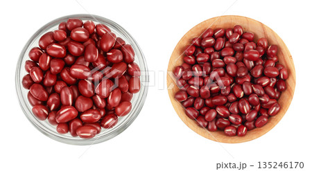 Red adzuki beans in glass and wooden bowl isolated on white background. Top view. Flat lay. 135246170