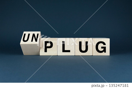 Wooden blocks spelling out Plug or Unplug Wooden blocks spelling out Plug or Unplug 135247181