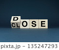 Wooden blocks spelling DOSE and CLOSE. 135247293