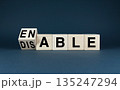 Wooden blocks spelling Enable or Disable 135247294