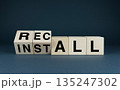 Wooden blocks with the words INSTALL and RECALL 135247302