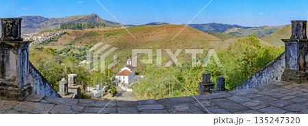 Historic churches and mountains 135247320