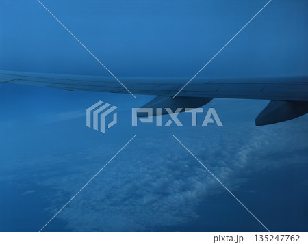 night sky imagery, sky view during flight, airplane wing captures moonlit cloudscape ambiance night sky imagery, sky view during flight, airplane wing captures moonlit cloudscape ambiance 135247762