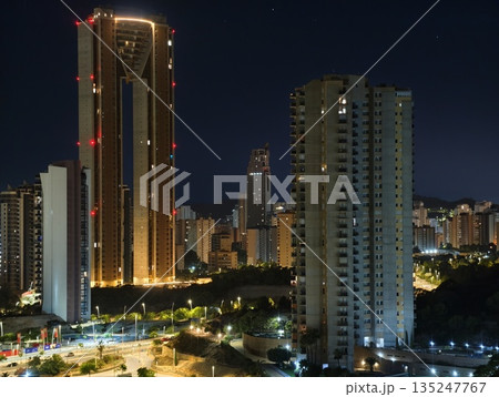 urban nightscape vibrancy, bright city skyline featuring nightlit skyscrapers and vibrant streets urban nightscape vibrancy, bright city skyline featuring nightlit skyscrapers and vibrant streets 135247767