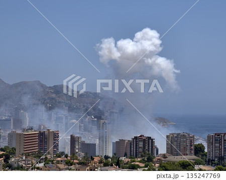 vertical smoke plume observed over coast, aerial footage captures towering smoke and emergency 135247769