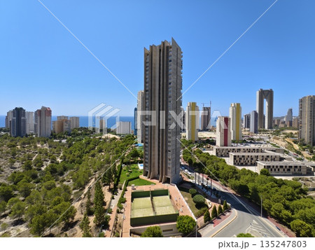 highrise buildings and coast view midday, aerial perspective showing skyscrapers and coastline 135247803