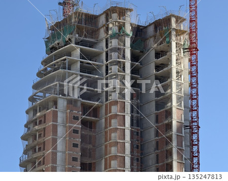 construction site of tall concrete building with engineering inspection and safety measures construction site of tall concrete building with engineering inspection and safety measures 135247813
