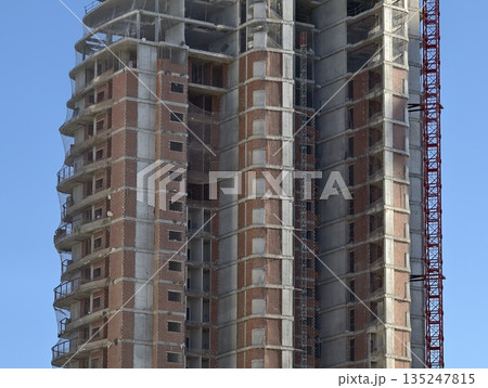 building in progress, ongoing building process with exposed structures and temporary platforms building in progress, ongoing building process with exposed structures and temporary platforms 135247815