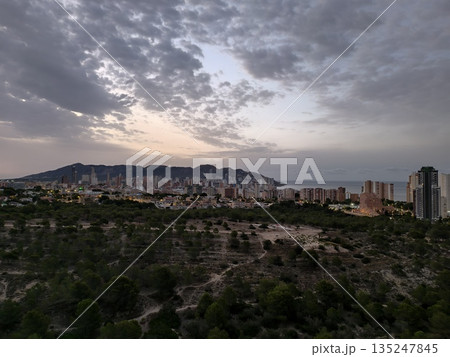 overcast urban landscape, overcast sky above mountain and town creates moody atmosphere with distant overcast urban landscape, overcast sky above mountain and town creates moody atmosphere with distant 135247845