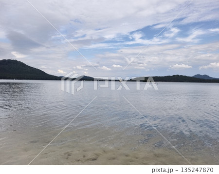 peaceful boat scene, quiet boat drifting by towering mountain peaks over mirrorlike water reflecting peaceful boat scene, quiet boat drifting by towering mountain peaks over mirrorlike water reflecting 135247870