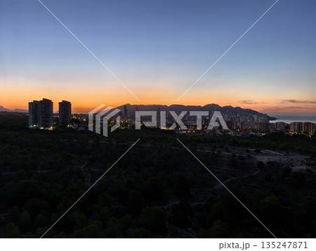 dusk paints bold skyline with fiery shades, vivid sunset illuminates city silhouette with warm glow dusk paints bold skyline with fiery shades, vivid sunset illuminates city silhouette with warm glow 135247871