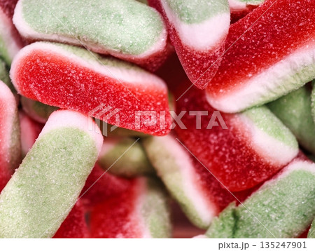 colorful candy delight, vivid patterned chewy candies with sparkling sugar coating for festivities 135247901