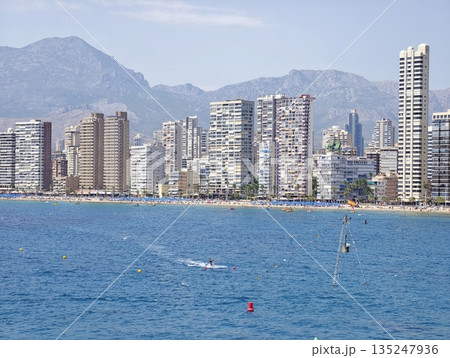 Vibrant bay scene with exhilarating activities and peaceful Vibrant bay scene with exhilarating activities and peaceful 135247936