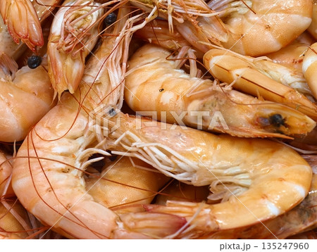 Professional kitchen dish featuring delicate shrimp with lemon 135247960