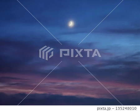 Moonlit violet panorama, Night sky with glowing celestial body Moonlit violet panorama, Night sky with glowing celestial body 135248010