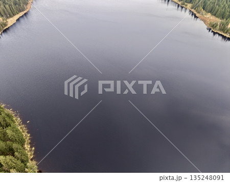 quiet lakeside with lush trees, peaceful water scene with winding coast and reflective surface quiet lakeside with lush trees, peaceful water scene with winding coast and reflective surface 135248091