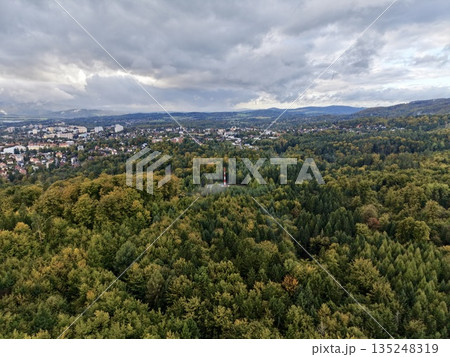 Suburban Natural Landscape, Settlement Outskirts Blending Into Lush Wooded Countryside With Winding Paths Suburban Natural Landscape, Settlement Outskirts Blending Into Lush Wooded Countryside With Winding Paths 135248319