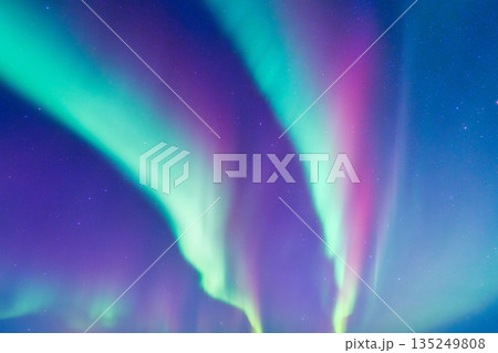 Spectacular Aurora Borealis dancing across the starry night sky. Spectacular Aurora Borealis dancing across the starry night sky. 135249808