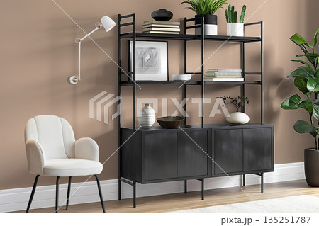 Modern black shelving unit with decorative items and stylish chair in contemporary interior design 135251787