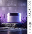 Transparent cosmetic jar mock-up with copy space surrounded by lavender flowers and soft lighting 135251901