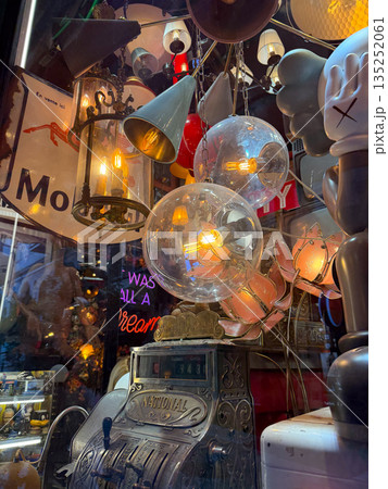Vintage lamps and chandeliers with warm glowing bulbs. Retro design, nostalgia, and cozy ambiance. Vintage lamps and chandeliers with warm glowing bulbs. Retro design, nostalgia, and cozy ambiance. 135252061