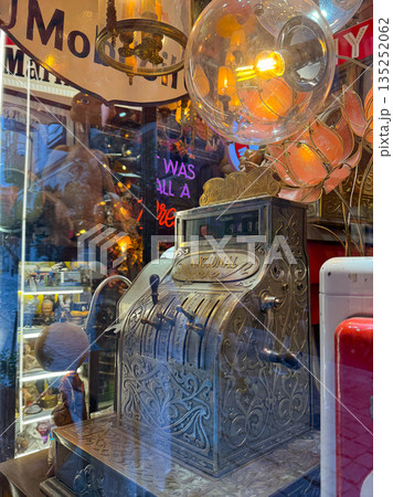Vintage lamps and chandeliers with warm glowing bulbs. Retro design, nostalgia, and cozy ambiance. Vintage lamps and chandeliers with warm glowing bulbs. Retro design, nostalgia, and cozy ambiance. 135252062
