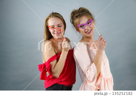 Two women with carnival masks Two women with carnival masks 135252182
