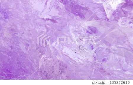 amethyst crystal displays frozen textures with cool Purple hues. The icy surface of the gemstone amethyst crystal displays frozen textures with cool Purple hues. The icy surface of the gemstone 135252619