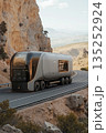 A futuristic concept of an autonomous electric semi-truck driving on a mountain road. Modern vehicle for future transportation and sustainable logistics 135252924