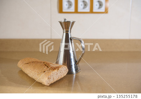 Bread Loaf And Metal Coffee Pot On Kitchen Counter In A Simple Food Scene 135255178