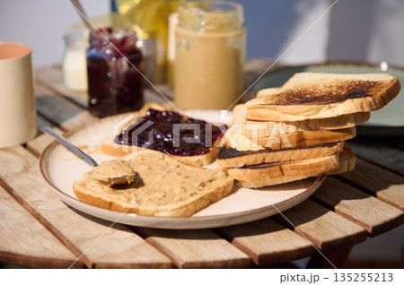 Stack Of Toast With Peanut Butter And Jelly On A Rustic Outdoor Table Stack Of Toast With Peanut Butter And Jelly On A Rustic Outdoor Table 135255213