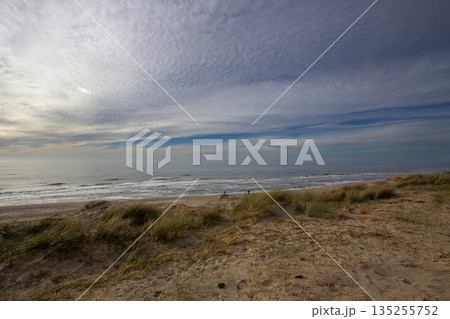 Sunset at the North Sea from the island Texel in the Netherlands. 135255752