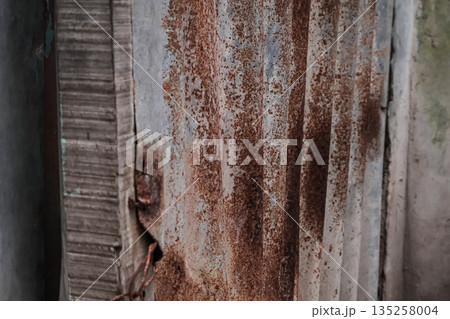 Textured rusty metal surface featuring detailed corrosion and weathered elements, ideal for industrial background and design concepts Textured rusty metal surface featuring detailed corrosion and weathered elements, ideal for industrial background and design concepts 135258004