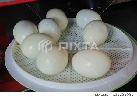 Hard-Boiled Eggs Arranged on Plastic Tray with Natural Light, Fresh and Ready for Breakfast, Salad, or Snack Preparation Hard-Boiled Eggs Arranged on Plastic Tray with Natural Light, Fresh and Ready for Breakfast, Salad, or Snack Preparation 135258080