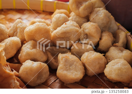 Delicious Indonesian Cireng Snack Piled on Woven Tray, Illuminated by Natural Light, Perfect for Street Food Promotion 135258083