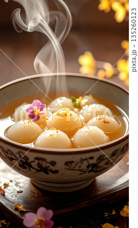 Chinese White Tangyuan Dessert Filled with Honey and Sweet Syrup 135260123