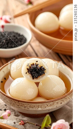 Tangyuan Made from Glutinous Rice with Black Sesame Filling in Ginger Soup or Syrup 135260136