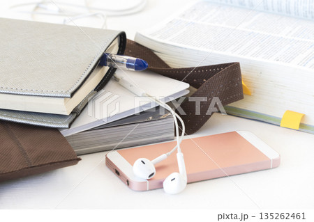 notebook, mobile phone and dictionary book for study in bag 135262461