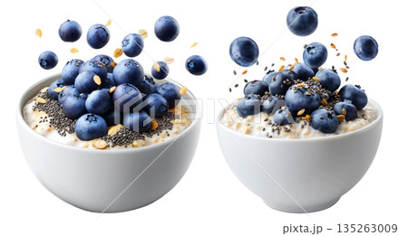 Fresh blueberries and chia seeds on creamy oatmeal in white ceramic bowl, isolated on white transparent background Fresh blueberries and chia seeds on creamy oatmeal in white ceramic bowl, isolated on white transparent background 135263009