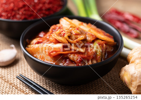 Kimchi cabbage in a bowl with ingredients, Korean food 135265254