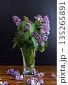beautiful bouquet of lilacs in a vase on a black background 135265891