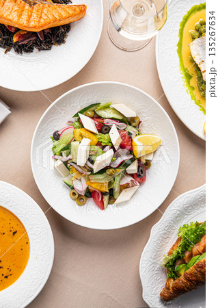 Mediterranean dishes with salad served on table 135267634